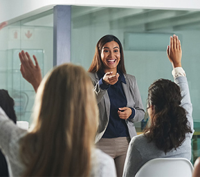 A woman answering peoples questions at work