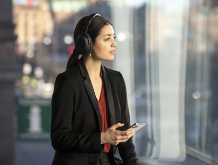 A Woman wearing an EPOS ADAPT Line headset